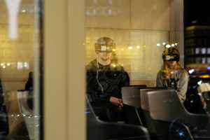 man and woman wearing a VR headset at an event